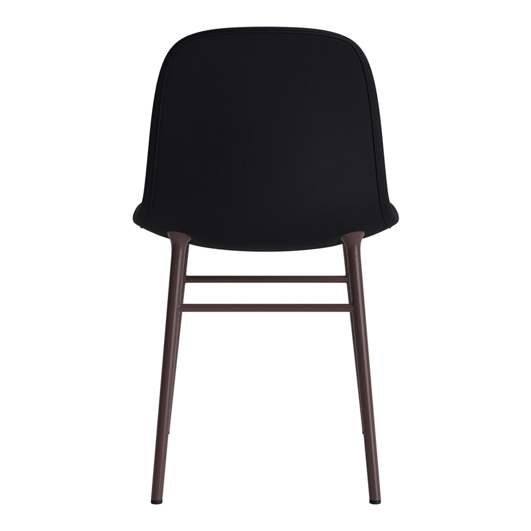 Black upholstered chair with sleek, minimal design and dark wood legs, perfect for modern interiors.