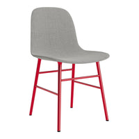 Gray upholstered chair with vibrant red metal legs, featuring a sleek, minimalist design. Perfect for modern decor.