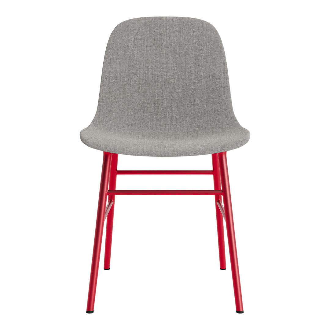 Gray upholstered chair with vibrant red legs, featuring a modern and minimalistic design. Ideal for any decor style.