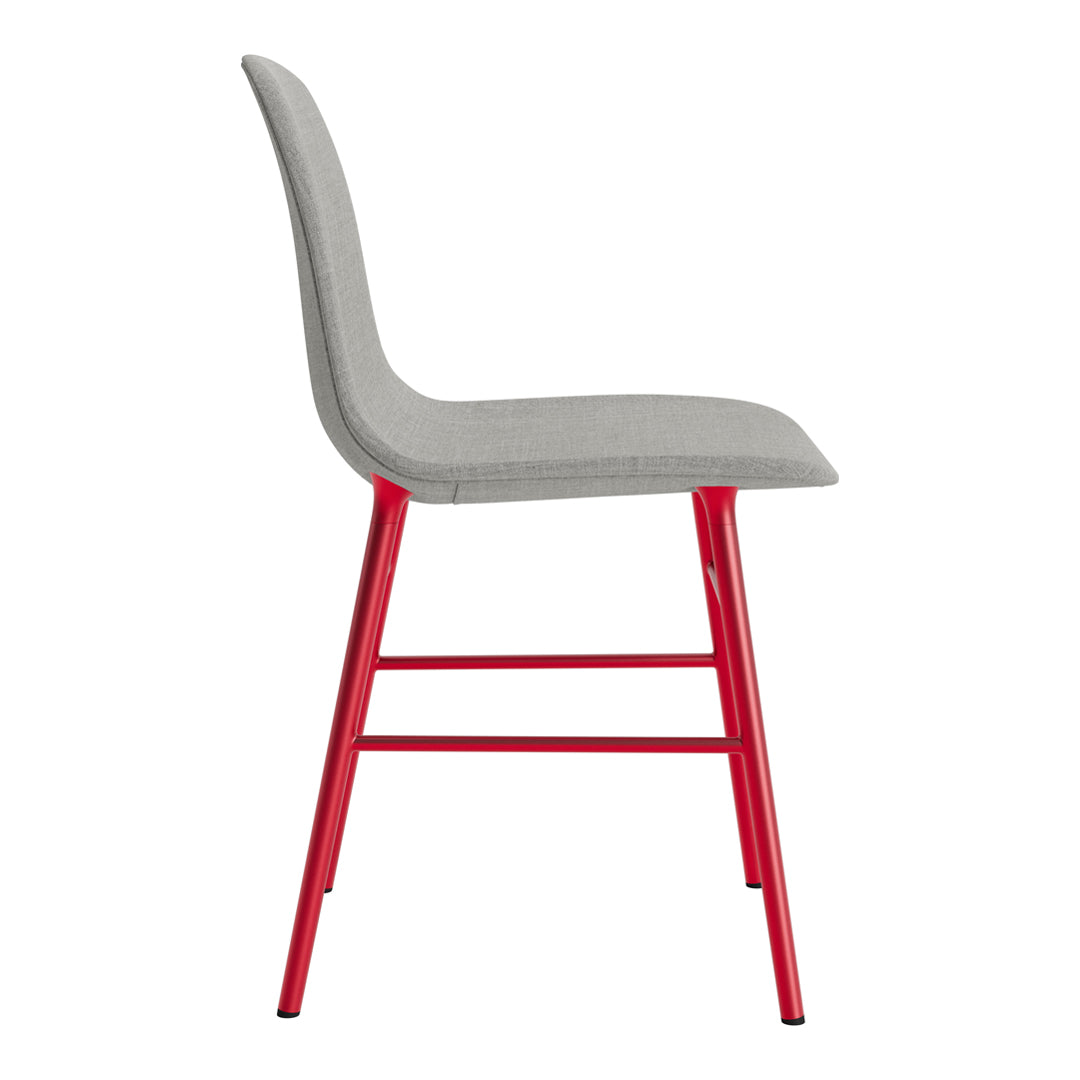 Gray upholstered chair with vibrant red metal legs, featuring a sleek and modern design.