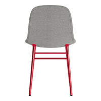 Gray upholstered chair with a sleek red metal frame, modern design, and minimalistic style.