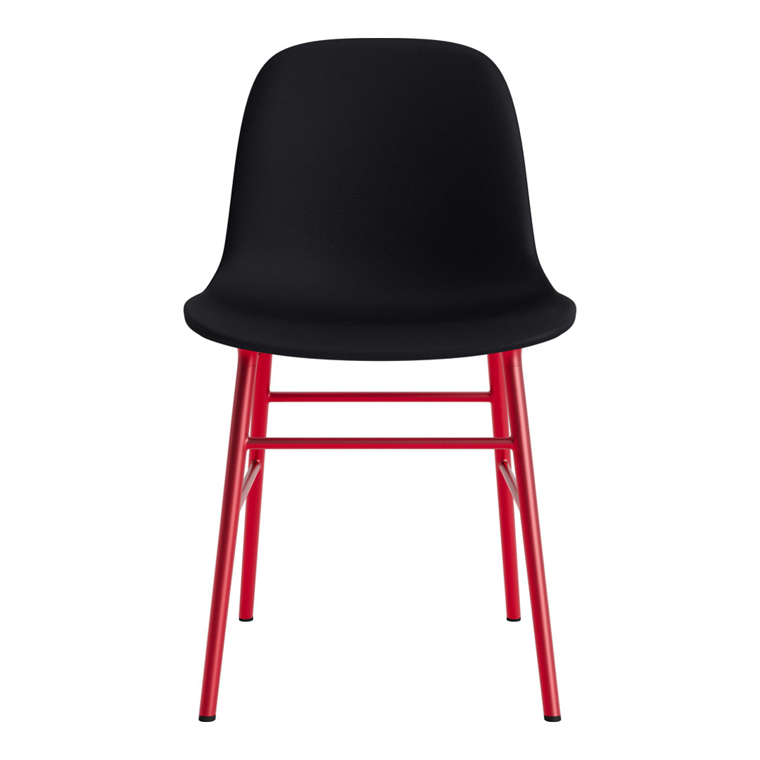 Black chair with a sleek, minimalist design featuring red metal legs, showcasing a modern color contrast.