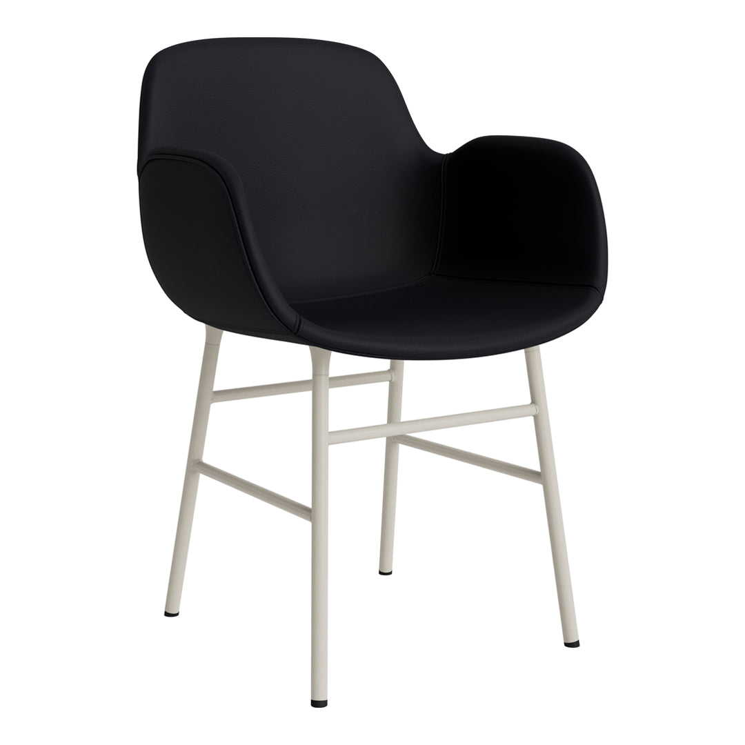 Black armchair with smooth surface and minimalist light gray metal legs. Ideal for modern decor.