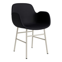 Black armchair with smooth surface and minimalist light gray metal legs. Ideal for modern decor.