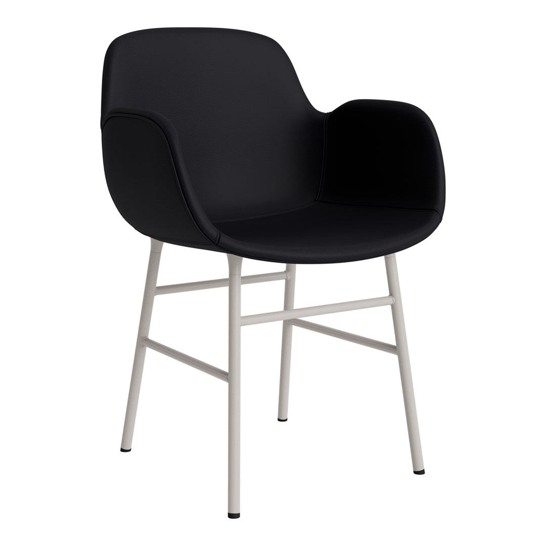 Black upholstered chair with minimalist design and sleek silver legs. Modern and stylish for any room.