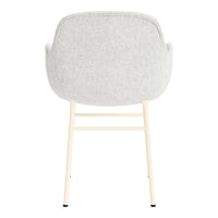 Light gray upholstered chair with a minimalist design and cream-colored legs. Clean, modern aesthetic.