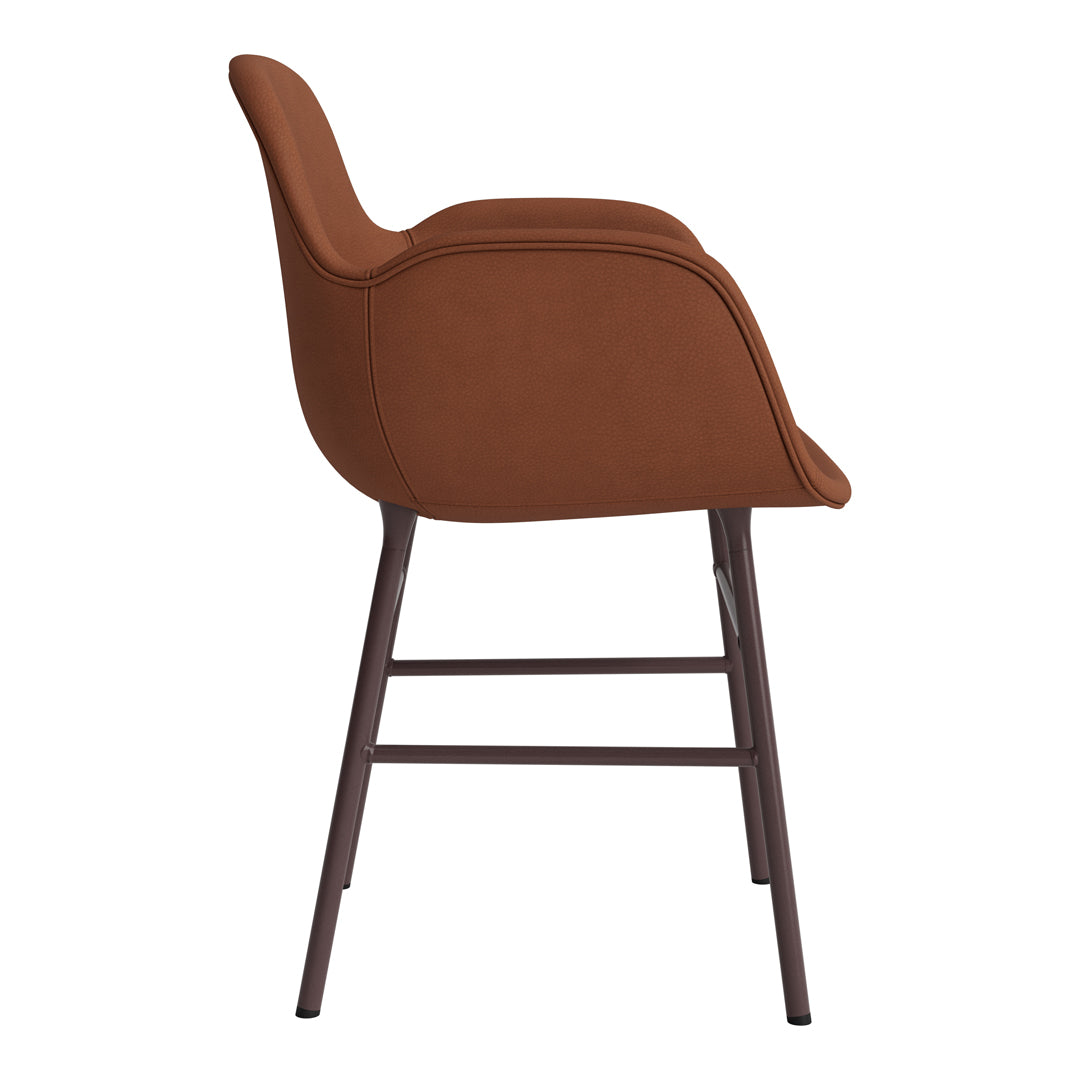 Modern brown upholstered chair with sleek lines and a contrasting dark metal frame, ideal for contemporary spaces.