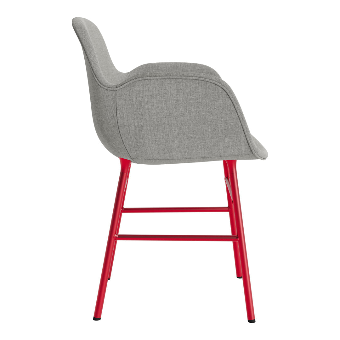 Gray upholstered chair with a smooth texture and bold red metal legs, perfect for modern decor.