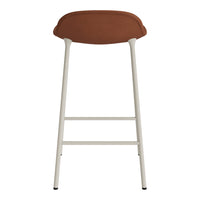 Brown upholstered bar stool with a sleek cream metal frame. Simple, modern design with a clean aesthetic.