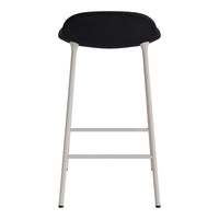 Black seat with a sleek, minimalist design on a light gray metal frame. Perfect for modern interiors.