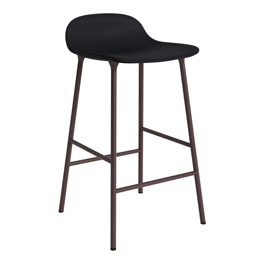 Black ergonomic bar stool with a matte finish and brown metal legs, perfect for modern interiors.