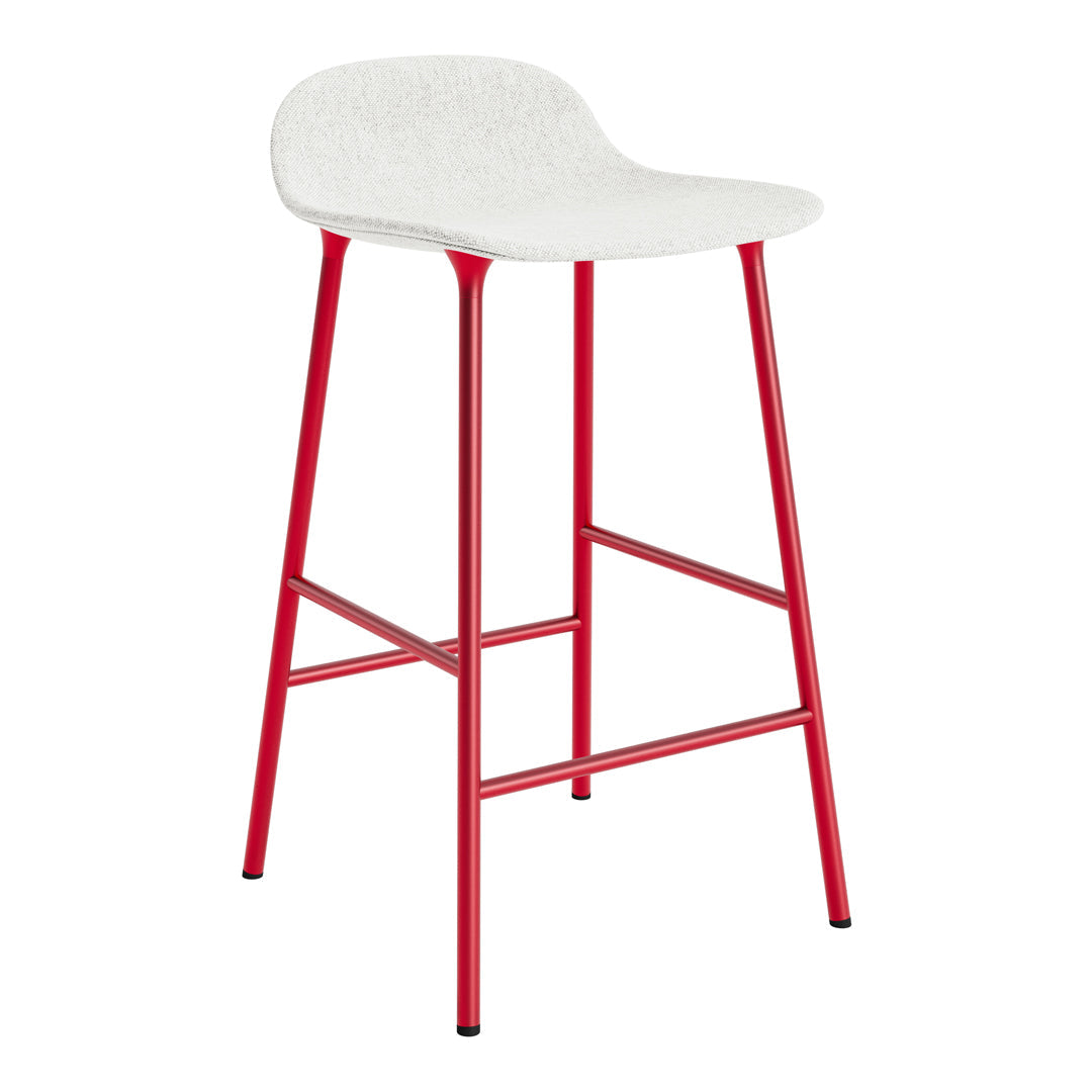 White bar stool with a textured seat and bold red metal legs, perfect for modern decor.