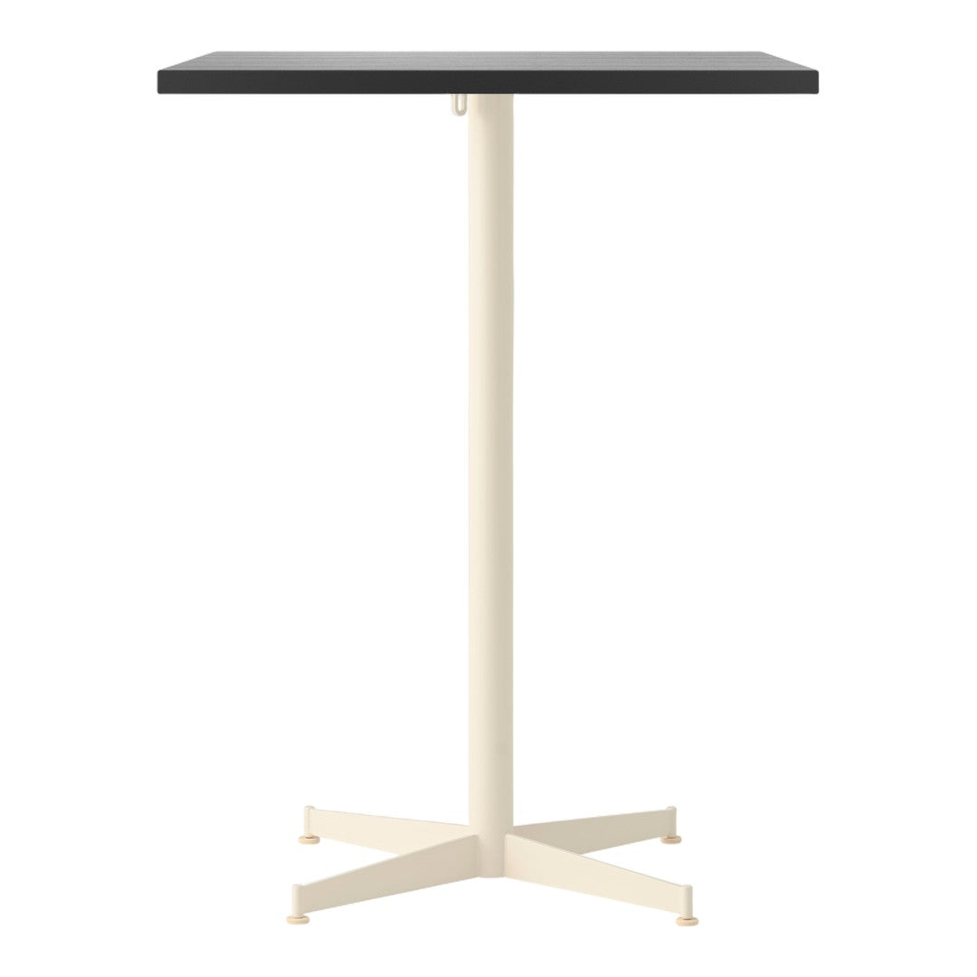 Black square table top with a cream-colored metal base and four-legged design. Modern and minimalist style.