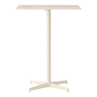 Modern cream-colored table with a smooth top and a sturdy crossbase, perfect for minimalist decor.