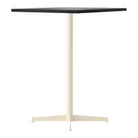 Black square tabletop with a creamy white metal base, featuring a minimalist, modern design.