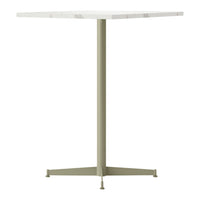 "Square tabletop in white with subtle gray veining, supported by a slender olive-green base."