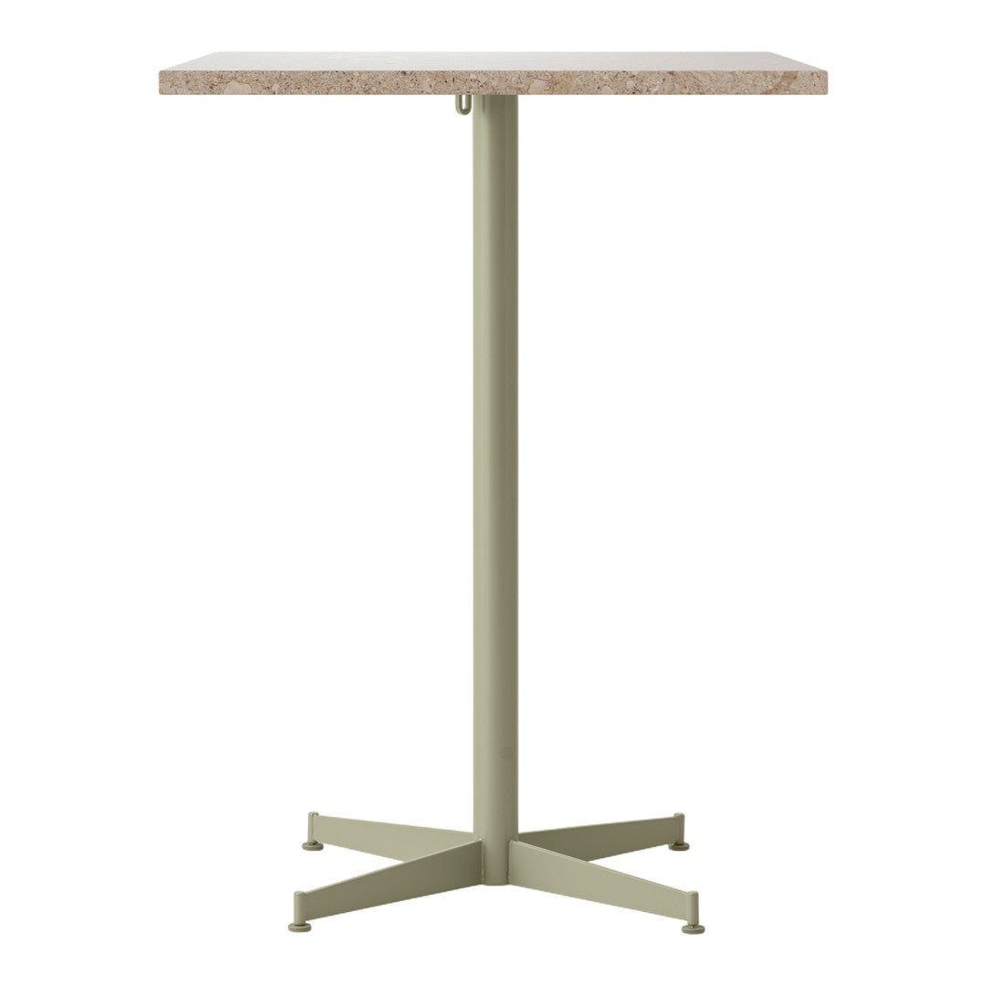 "Round top table with a beige natural stone surface and a muted green metal base."