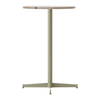 Round tabletop in light beige with a sleek green metal base, perfect for modern decor.
