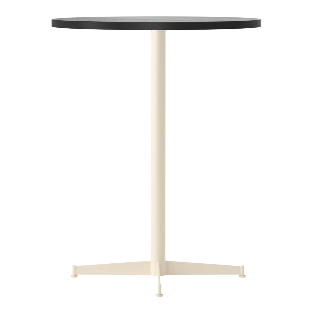 Round table featuring a sleek black top and a minimalist cream-colored base, perfect for modern decor.