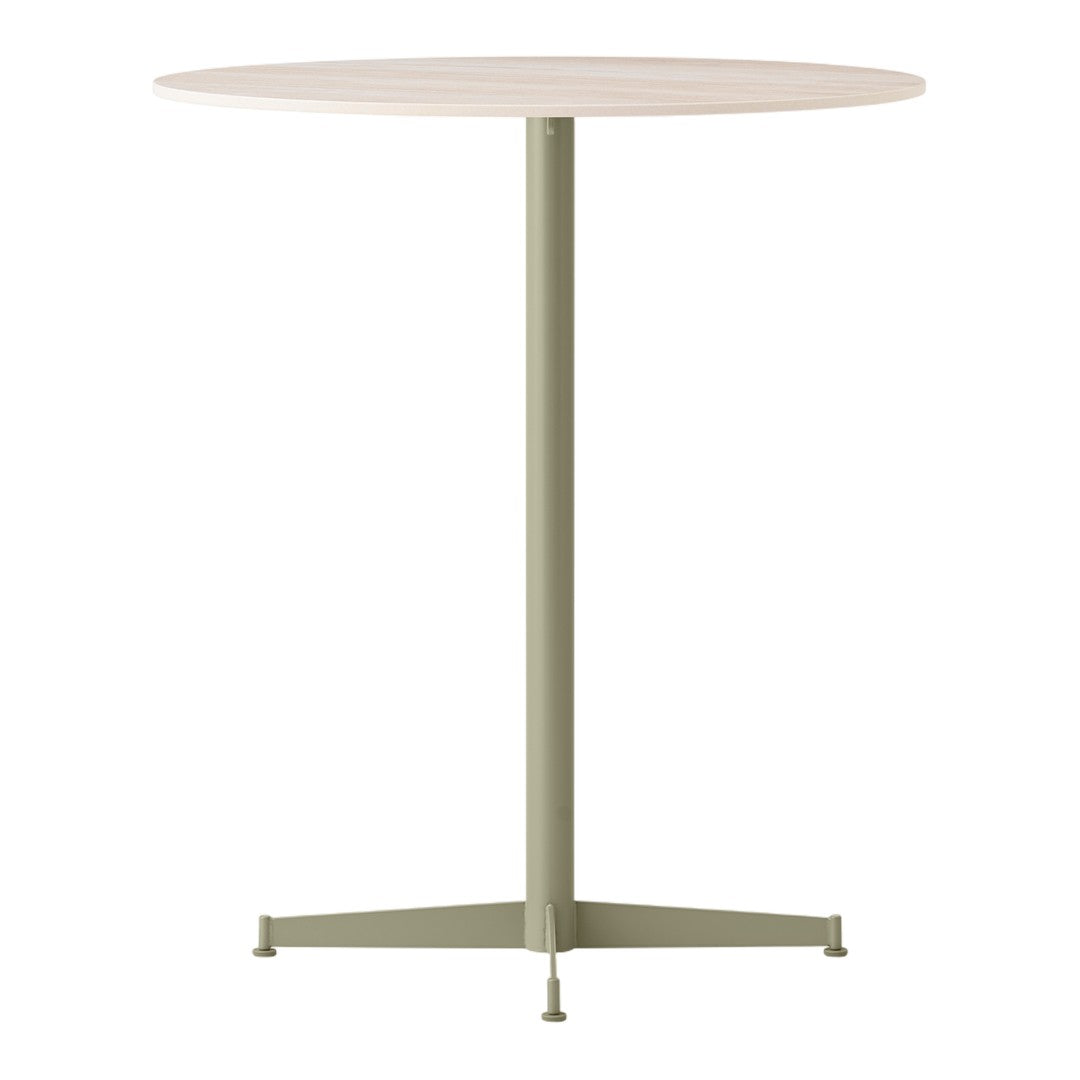 Round table with a light wood top and a muted green metal base, featuring a minimalist design.