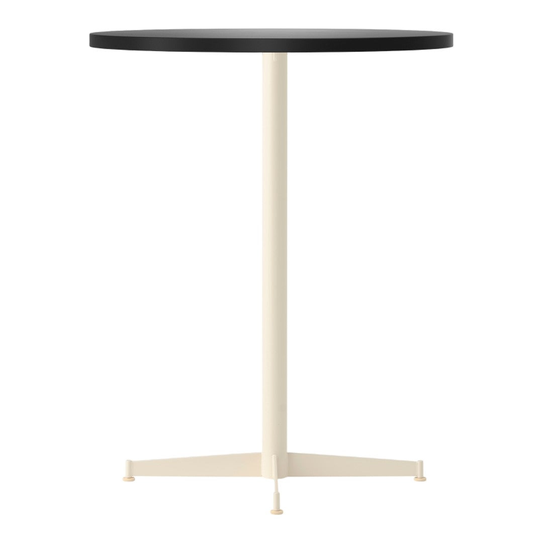 Round black tabletop with a cream-colored base, featuring a minimalist design and solid colors.
