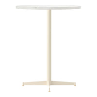 Round white tabletop with a sleek cream-colored metal base, modern minimalist design.