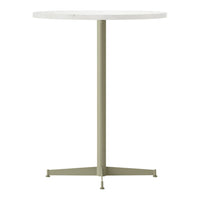White circular tabletop with a light green metal base. Simple and modern design, perfect for any decor.