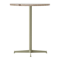 Round table with a speckled light beige top and a muted olive green metal base. Minimalist design, neutral colors.