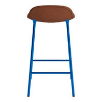 Brown padded seat with vibrant blue metal legs, sleek modern design, perfect for contemporary spaces.