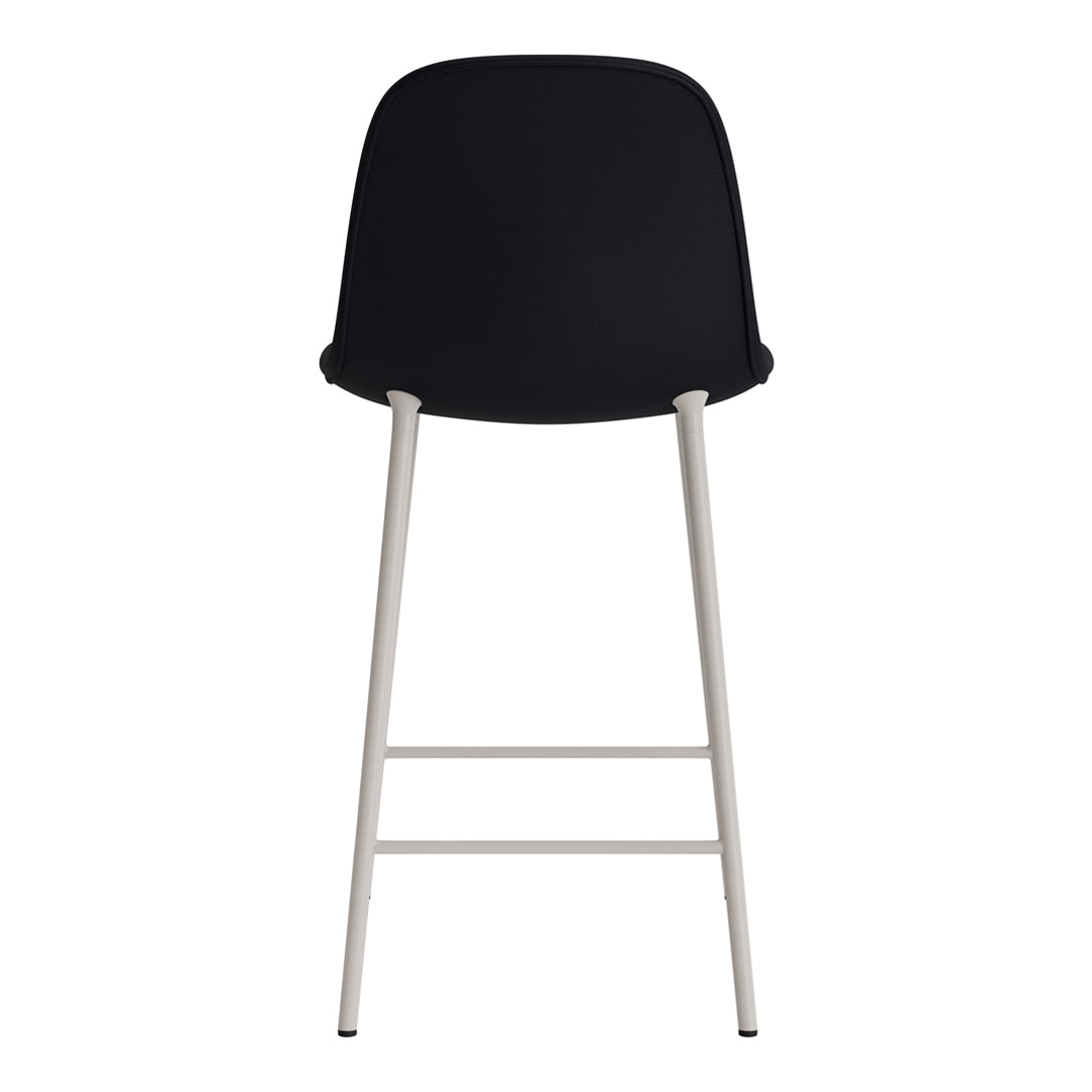 Black upholstered bar stool with sleek silver legs, featuring a minimalist design. Perfect for modern spaces.