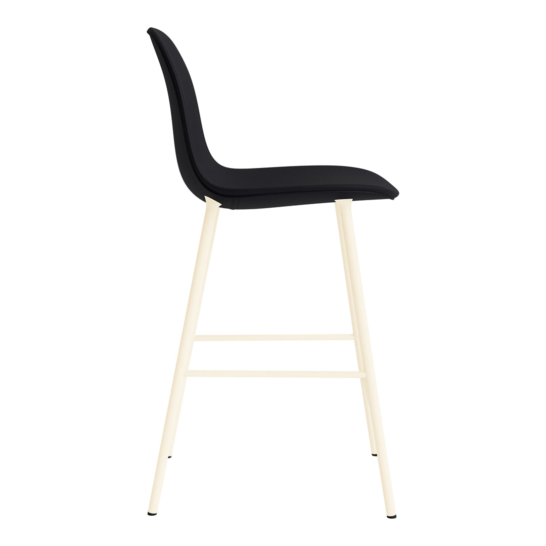 Black upholstered bar stool with sleek, minimalistic design and light beige metal legs.