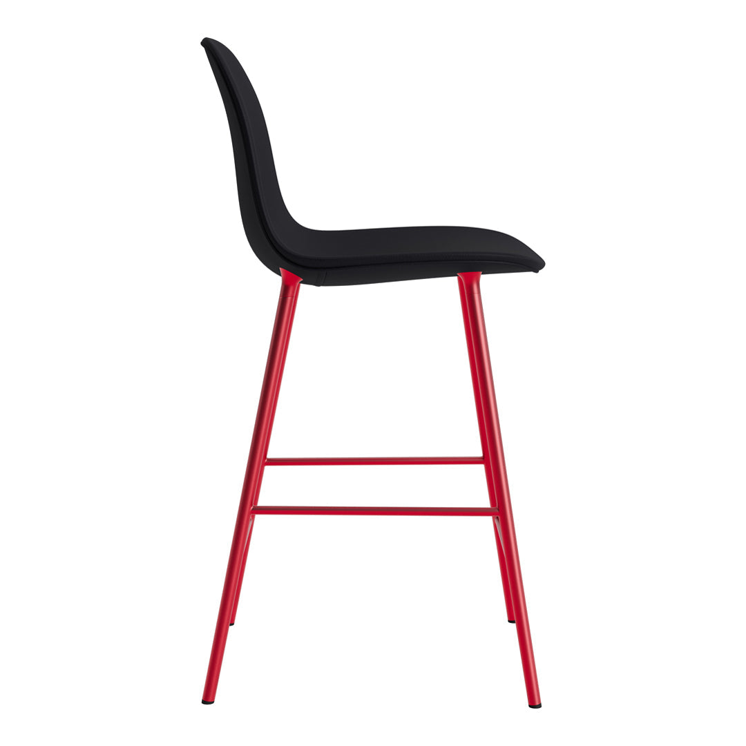 Black cushioned seat with sleek red metal legs, featuring a modern and minimalist design.