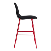 Black cushioned seat with sleek red metal legs, featuring a modern and minimalist design.