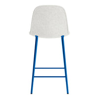 White upholstered chair with blue metal legs, featuring a sleek, modern design and minimalist aesthetic.
