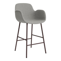 Grey upholstered bar stool with a sleek design and brown metal legs, perfect for modern interiors.