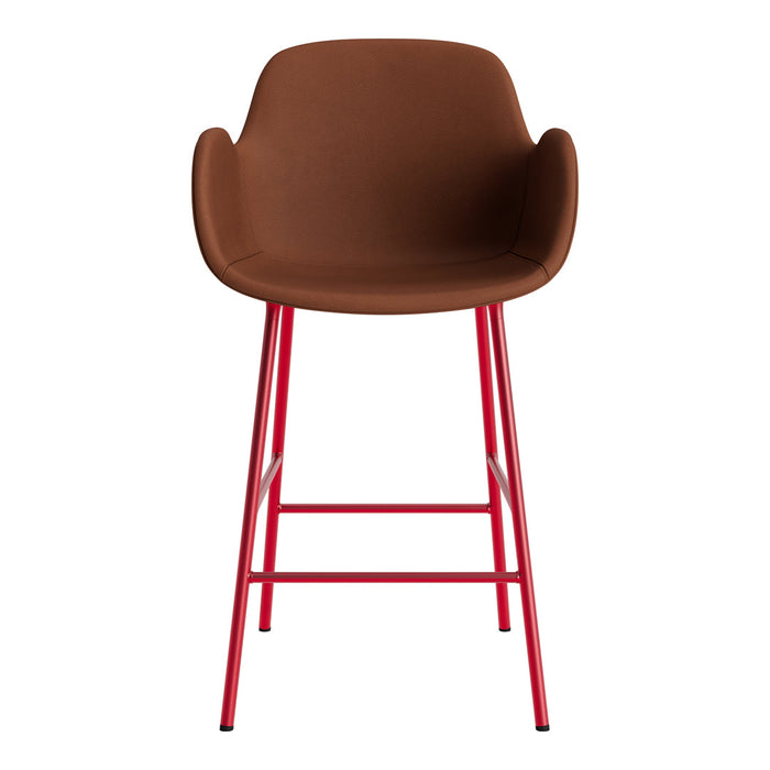 Brown upholstered bar stool with sleek red metal legs, featuring a modern, minimalist design.