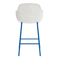 Back view of a chair with a light gray upholstered seat and vibrant blue metal legs. Modern design in neutral colors.