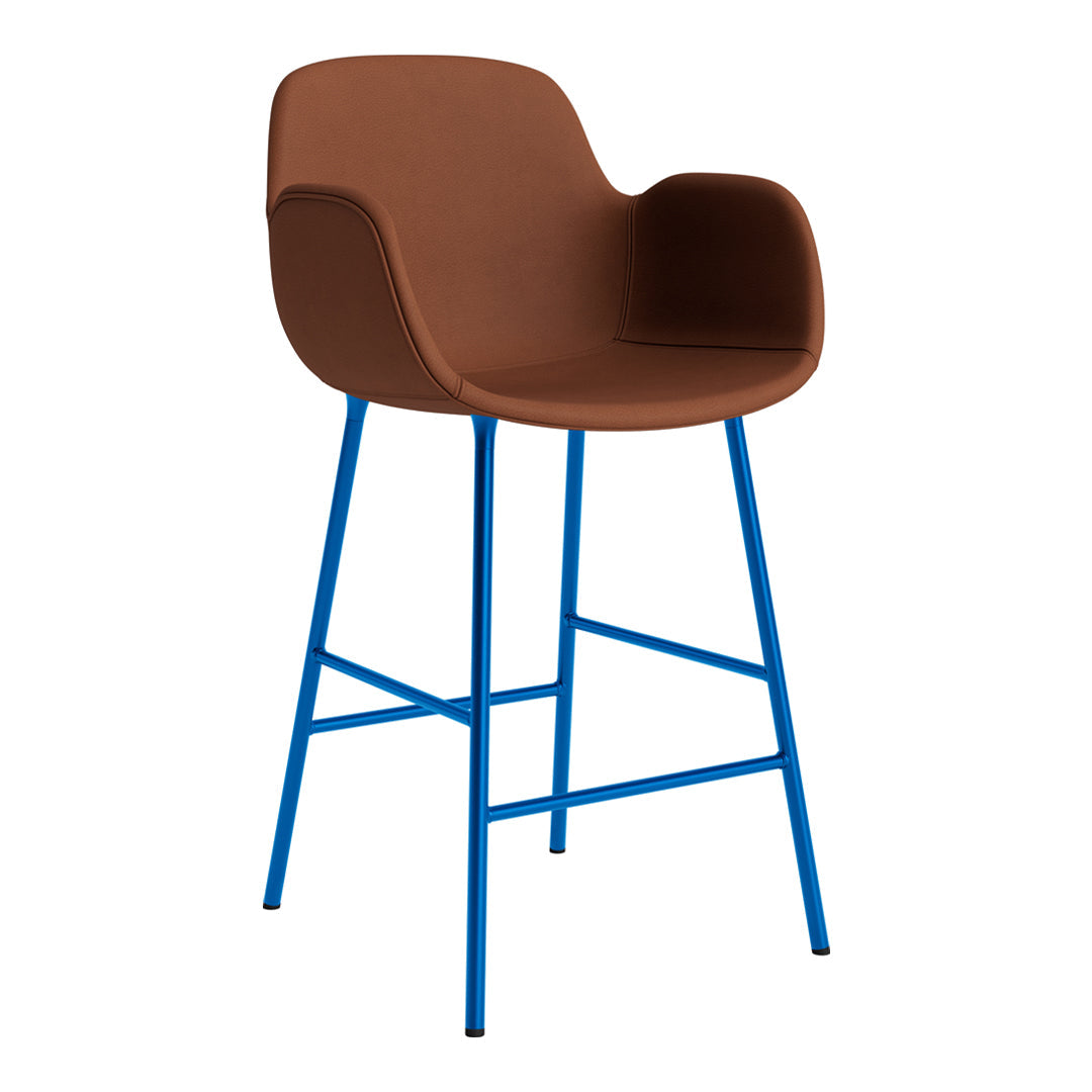 Brown upholstered bar stool with bold blue legs, featuring a smooth, modern design. Perfect for contemporary decor.