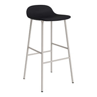 Black bar stool with a smooth, minimalist design and sleek silver legs, perfect for modern interiors.
