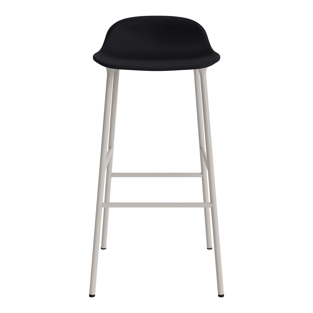 Black seat with sleek curves and minimalist white metal legs. Modern design ideal for contemporary decor.