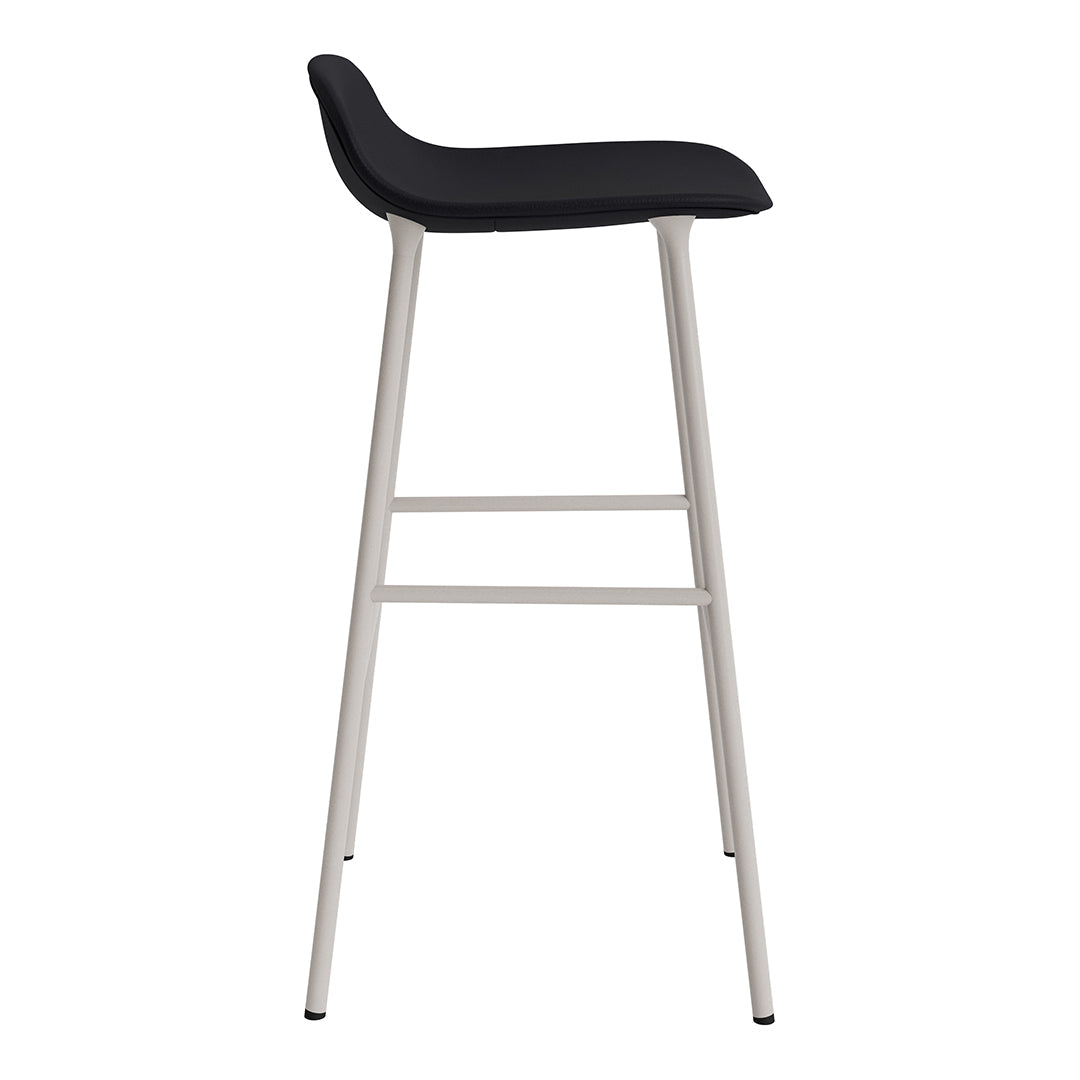 Black upholstered bar stool with sleek silver metal legs, modern design, and minimalist aesthetic.
