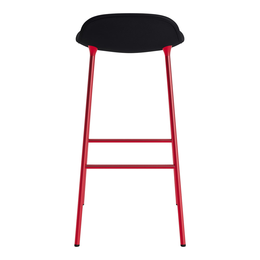 Black bar stool with a sleek, rounded seat and vibrant red legs, creating a modern two-tone design.