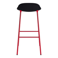 Black bar stool with a sleek, rounded seat and vibrant red legs, creating a modern two-tone design.