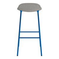 Blue metal bar stool with a textured grey fabric seat, offering a modern and stylish design.