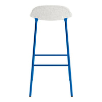 Blue metal bar stool with a light gray fabric seat and simple, modern design. Perfect for contemporary spaces.