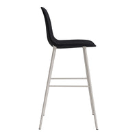 Black upholstered bar stool with a sleek silver metal frame and minimalistic design. Ideal for modern decor.