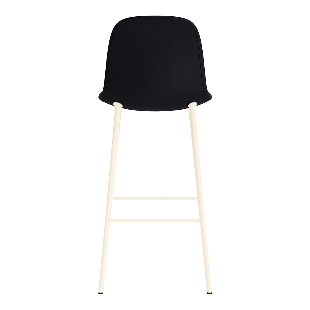 Black upholstered bar stool with a minimalist design and creamy white legs, perfect for modern spaces.
