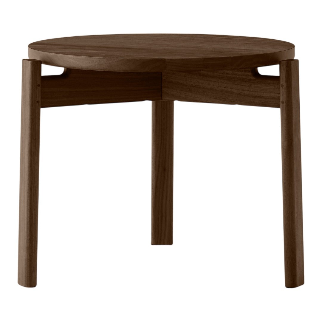 Round wooden table in rich dark mahogany finish with smooth surface and minimalist design. Perfect for any decor.