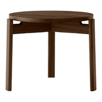 Round wooden table in rich dark mahogany finish with smooth surface and minimalist design. Perfect for any decor.