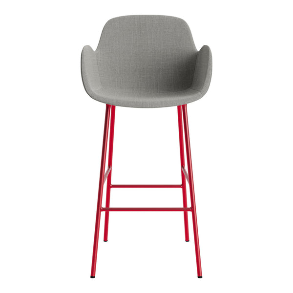 Gray upholstered bar stool with red metal legs, featuring a sleek, modern design. Ideal for contemporary spaces.